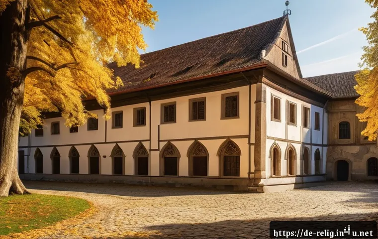 종교적 유산의 보존 - A detailed, atmospheric view of a historic Bavarian monastery courtyard during early autumn, showcas...
